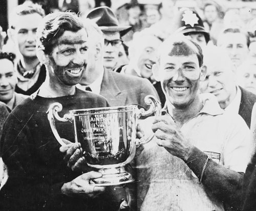 Tony Brooks and Stirling Moss celebrate winning the British Grand Prix