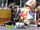 Jarno Trulli picks his way through an accident in the soapbox race on the pit straight