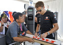 Jenson Button signs an old Honda rear wing