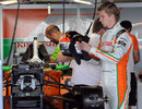 Nico Hulkenberg prepares his equipment in the Force India garage