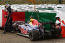 Sebastian Vettel walks away from his Red Bull after crashing at Degner 2