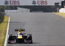 Mark Webber heads for 130R with his DRS open
