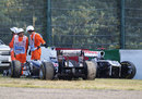 Rubens Barrichello's and Pastor Maldonado's stricken Williams' sit on the outside of the Degner curves