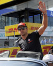 Jenson Button waves to the fans