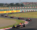 Sebastian Vettel leads the pack through the Esses on the first lap