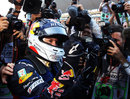 Sebastian Vettel celebrates his second world championship in a row in front of the cameras