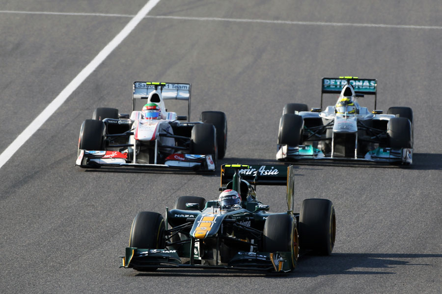 Nico Rosberg battles with Sergio Perez and Jarno Trulli