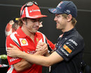 Fernando Alonso greets Sebastian Vettel
