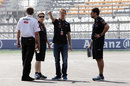 Sebastian Vettel talks to his mechanics during a track walk