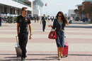 Jenson Button and his girlfriend Jessica Michibata arrive at the circuit