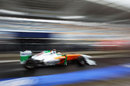 Adrian Sutil speeds down the pit lane