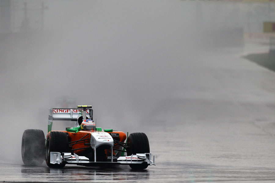 Paul di Resta aims for the apex of turn one