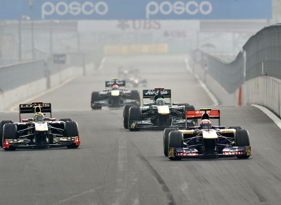 Jaime Alguersuari leads a gaggle of cars into turn three