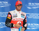 Lewis Hamilton faces photographers after securing pole position