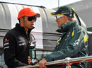 Lewis Hamilton talks to Heikki Kovalainen