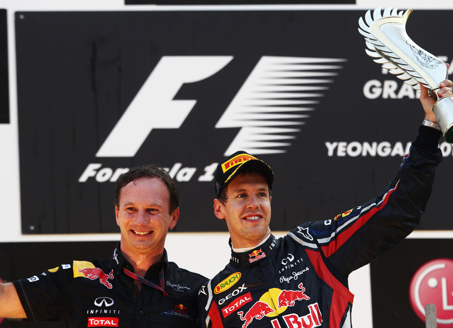 Sebastian Vettel and Christian Horner celebrate on the podium