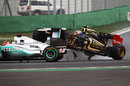 Vitaly Petrov ploughs in to the back of Michael Schumacher at turn three