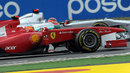 Fernando Alonso has to avoid Michael Schumacher after leaving the pit lane