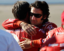 Dario Franchitti hugs a crew member after driver Dan Wheldon was killed during the Las Vegas Indy 300