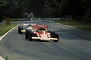 Jochen Rindt holds off Jack Brabham on his way to his third successive win at the British GP