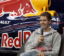 Sebastian Vettel talks to the press at the Red Bull factory 
