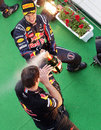 Sebastian Vettel sprays Christian Horner with champagne