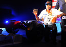 Narain Karthikeyan poses for a photo during a sponsor's photoshoot one week before his return to the HRT race seat in India