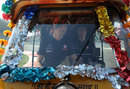 Jenson Button takes an autorickshaw for a spin around the Buddh International Circuit