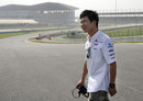 Kamui Kobayashi walks around the Buddh International Circuit