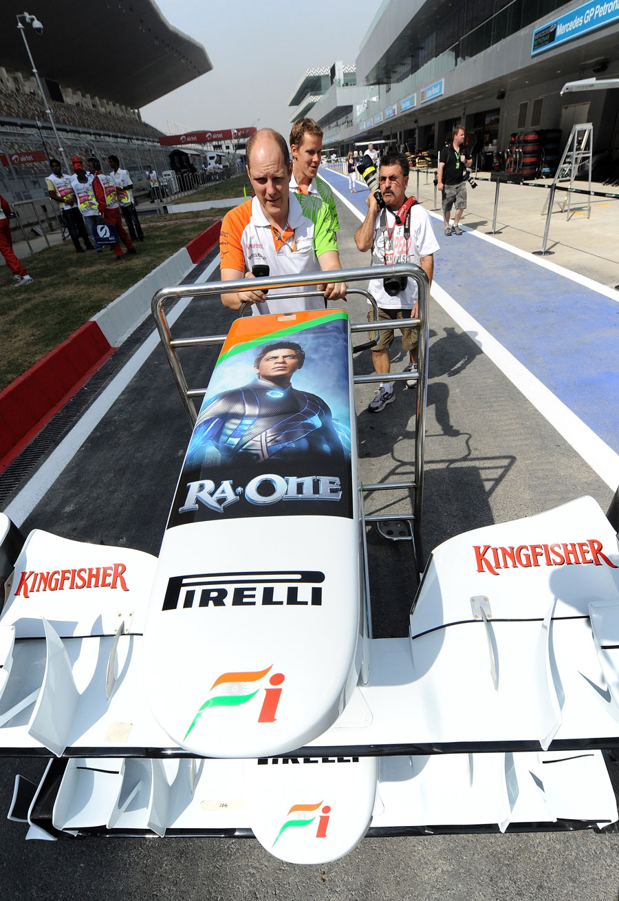 The Force India adorned with a poster of Indian Bollywood star Shah Rukh Khan's latest film Ra-One