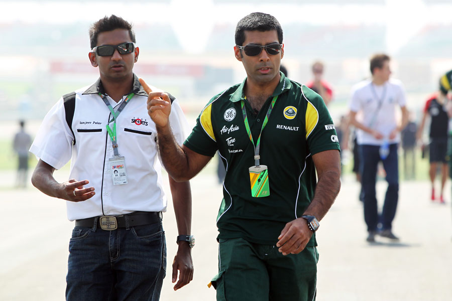 Lotus reserve driver Karun Chandhok  walks the track 
