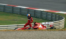 Fernando Alonso climbs out of his stricken Ferrari