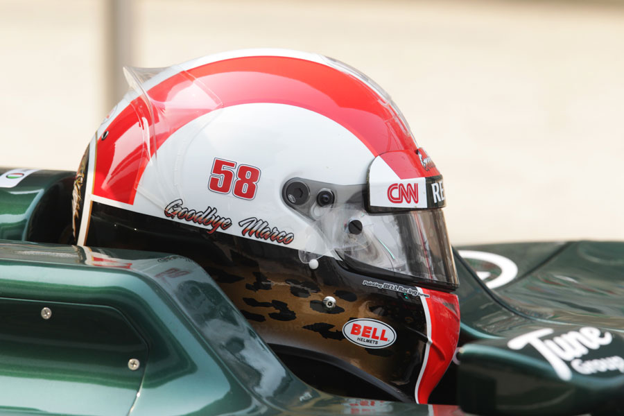 Jarno Trulli sporting a helmet in tribute to Marco Simoncelli