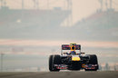 Mark Webber crests the hill at turn three