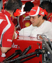 Felipe Massa chats with his mechanic