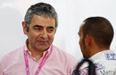 Lewis Hamilton chats to Rowan Atkinson in the McLaren garage