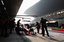 Jenson Button hits his marks as he returns to the pits