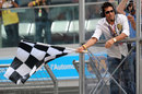 Sachin Tendulkar waves the chequered flag