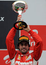 Fernando Alonso celebrates finishing third