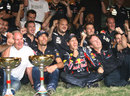 Sebastian Vettel celebrates with Mark Webber, Christian Horner and Helmut Marko
