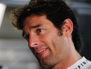 Mark Webber keeps an eye on the timing screens