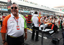 Vijay Mallya stands by Adrian Sutil's Force India on the grid