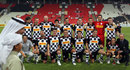 The drivers' team pose before a charity match against football stars