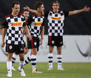 Vitaly Petrov shouts instructions to Stefano Coletti and Felipe Massa during a charity match