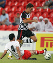 Stefano Coletti hurdles a tackle during a charity match