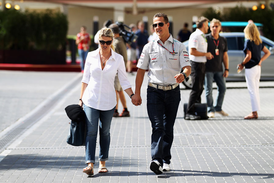 Michael Schumacher arrives at the circuit with his wife Corrina
