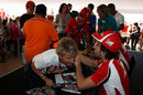 Fernando Alonso at an autograph signing session