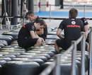 McLaren mechanics work on the team's allocation of Pirelli tyres