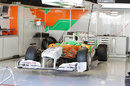The Force India VJM04 sits in the garage
