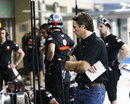 McLaren's new sporting director Sam Michael oversees pit stop practice in the pit lane